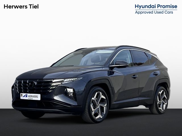 Hyundai Tucson 1.6 T-GDI HEV Comfort Smart Automaat / Fabrieksgarantie tot 02-2028 ** / Dealer onderhouden / Navigatie / Achteruitrijcamera / Stuur- en stoelverwarming / Apple Carplay Android / 19" LM + All Season banden /