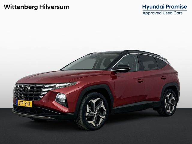 Hyundai Tucson 1.6 T-GDI PHEV COMFORT SMART 4WD | SoH 98%! | DE LUXE | TWOTONE | TREKHAAK | PDC VOOR | CLIMA | CRUISE | CAMERA | I-KEY | NAVI | STOELVERWARMING | 19'' LM VELGEN |