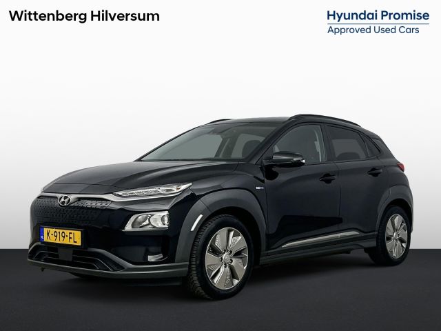 Hyundai Kona EV FASHION 64 kWh |  Soh 96% | DODEHOEK DETECTIE | PDC | 3 FASEN | WARMTEPOMP | CAMERA | CLIMA | CRUISE | NAVI | STOELVERWARMING | STUURVERWARMING | PRIVACY GLASS |