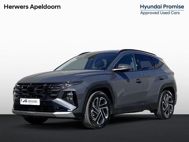 Hyundai Tucson 1.6 T-GDI HEV 215pk Premium / Nieuw model / Fabrieksgarantie tot 7-2029 / Dealer onderhouden / Navigatie / Stuur- en stoelverwarming / Elektrische klep / Adaptieve CC / 19"LM wielen /