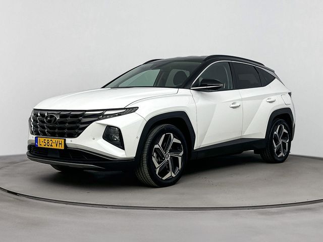 Hyundai Tucson 1.6 T-GDI PHEV PREMIUM 4WD | TWO TONE | TREKHAAK AFNEEMBAAR | NAVI | LEDER | CLIMA | CRUISE ADAPT. | 360 CAMERA | 19'' LM VELGEN | ELEKTRISCHE ACHTERKLEP | STOEL - & STUURVERWARMING | PLUG IN HYBRID |