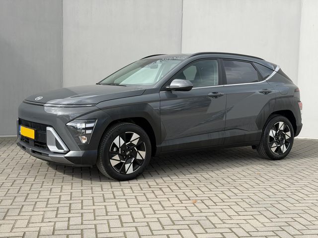 Hyundai Kona 1.6 GDI HEV Comfort Smart Automaat / Fabrieksgarantie tot 1-2030 / Stuur- & Stoel verwarming / Achteruitrijcamera / Apple Carplay Android Auto / Keyless Entry/Start / Adaptief cruise control / Draadloze telefoon lader / Climate control /