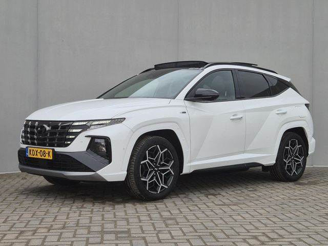 Hyundai Tucson 1.6 T-GDI PHEV N Line Sky 4WD Automaat / Trekgewicht 1.350 kg / Elektrische achterklep / EAER bereik 62 km bereik stad 74 km / Stuur- Stoel & Achterbankverwarming / Glazen schuif- en kanteldak / Rondomzicht camera / Adaptief cruise control / Apple Carplay Android Auto /