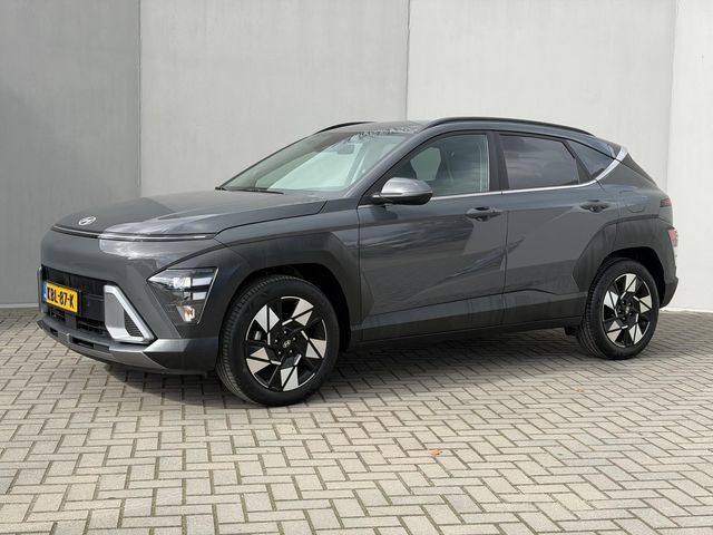Hyundai Kona 1.6 GDI HEV Comfort Smart / Fabrieksgarantie tot 1-2030 / Stuur- & Stoelverwarming / Apple Carplay Android Auto / Achteruitrijcamera / Keyless Entry/Start / Adaptief cruise control / Climate control / Navigatie / Parkeersensoren voor en achter /