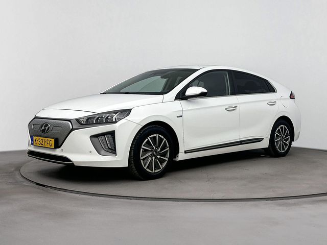 Hyundai IONIQ PREMIUM EV 38 kWh | TREKHAAK | ALL SEASONS | VERWARMDE VOORSTOELEN | LEDER | CRUISE ADAPT. | CLIMA | CAMERA | NAVI | WARMTEPOMP | APPLE CAR PLAY & ANDROID AUTO | 16'' LM VELGEN |