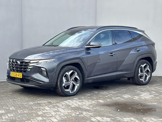 Hyundai Tucson 1.6 T-GDI PHEV Comfort Smart 4WD Automaat / Elektrische Achterklep / Org. NL / Fabrieksgarantie tot 06-2029 / Achteruitrijcamera / Stuur- en Stoelverwarming / 1.350 kg Trekgewicht / Climate Control /  Adaptieve Cruise Control / Apple Carplay & Android Auto / Keyless Entry & Start / Navigatie full map /