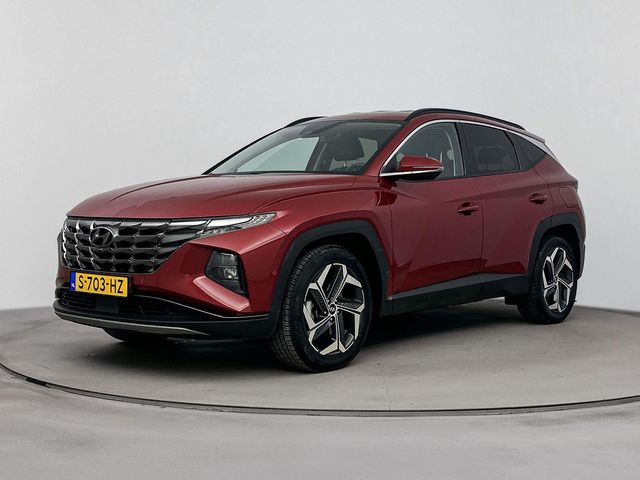 Hyundai Tucson 1.6 T-GDI HEV Premium | Leer | Trekhaak | Trekgewicht 1650kg | Memory | Stoel + stuurverwarming |