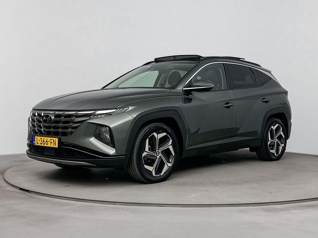 Hyundai Tucson 1.6 T-GDI HEV Premium Sky | Trekhaak 1650 KG | Navigatie & Carplay| leer | schuif/kanteldak | 360 camera |