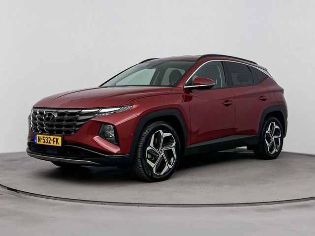 Hyundai Tucson 1.6 T-GDI HEV Premium | Leer | Stoel + stuurverwarming | Trekhaak | Trekgewicht 1650kg | Memory | Stoelventilatie |
